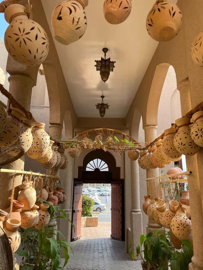AMOUAGE: Full Day Private Trip to Nizwa and Al Jabal Akhdar - Birkat Al Mouz: Mud-Brick Houses and Falaj Water Wisdom