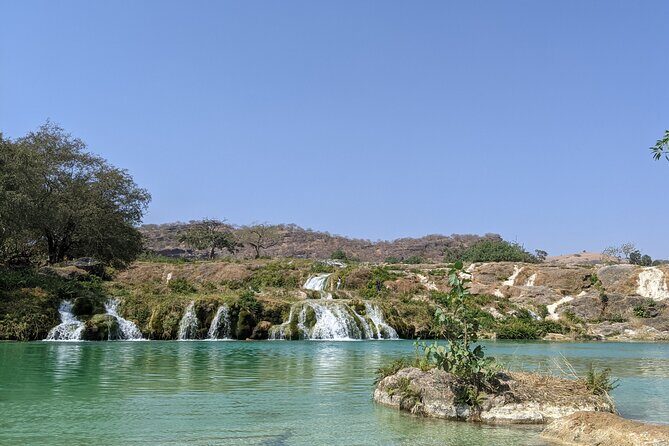 East and West Salalah Combination Private Full-day Tour - Wadi Darbat: Waterfalls, Caves, Camels, and Seasonal Drama