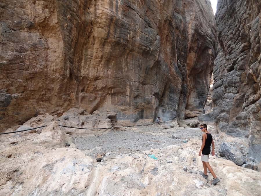 From Muscat: 4-Day Oman Highlights Tour - Nakhl Fortress: date palms, mountain rock, and fort details that feel real