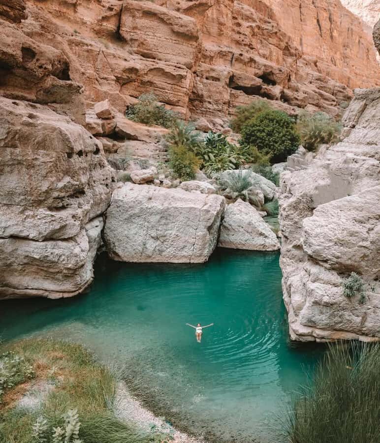 from muscat wadi shab and bimmah sinkhole tour - Guide Moments That Make the Difference
