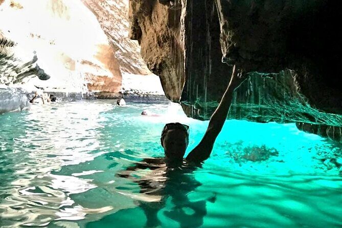 Full Day Group Tour to Wadi Shab Bimmah Sinkhole and Fins Beach - Bimmah Sinkhole: A Meteor Crater With Sea-Side Stair Steps