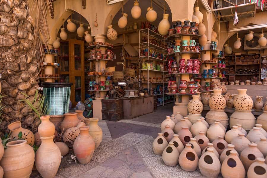 Full-Day Tour in Oman: Enchanting Forts of Nizwa and Jabreen - Entering Nizwa Fort: the cannon tower and the walls you feel
