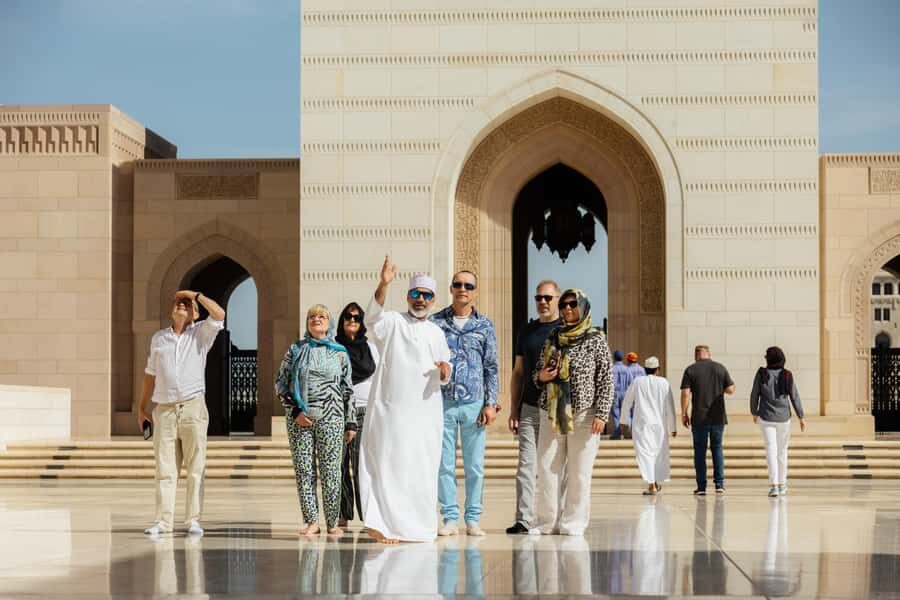 Guided Walking Tour of Sultan Qaboos Grand Mosque in Muscat - Open-air corridors and sandstone columns: where your eyes slow down