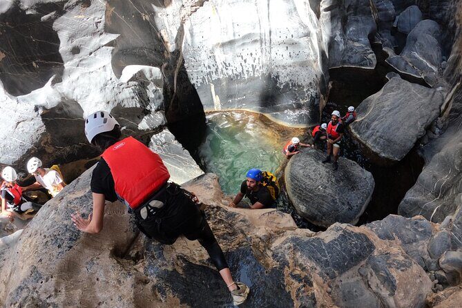 Half Day - Snake Canyon Adventure Tour in Jebel Shams - Pool time in clear water: jumps, swims, and cold reality