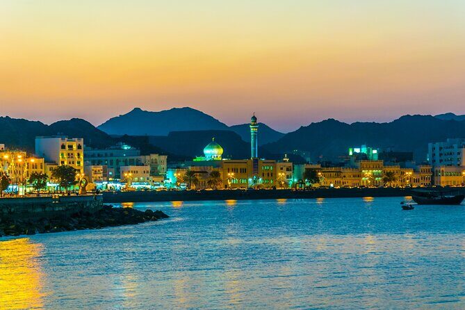 Historical Muscat Sunset Tour - The bay stop and the golden hour setup behind the mountains